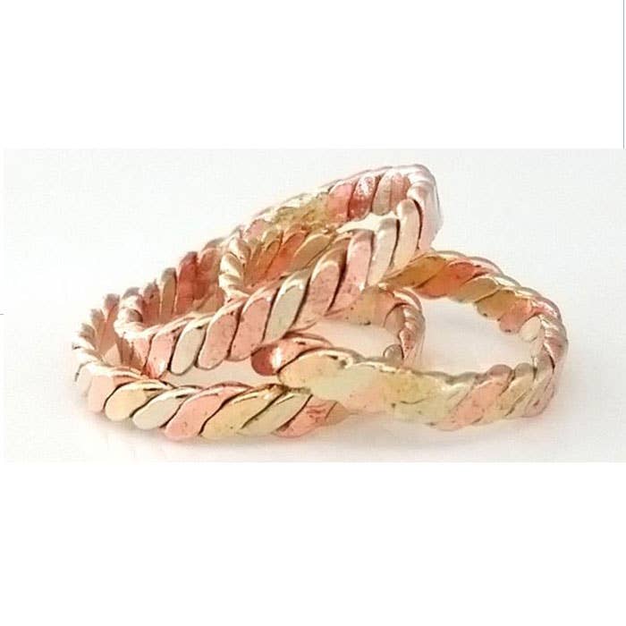 Braided Rings in Three Married Metals